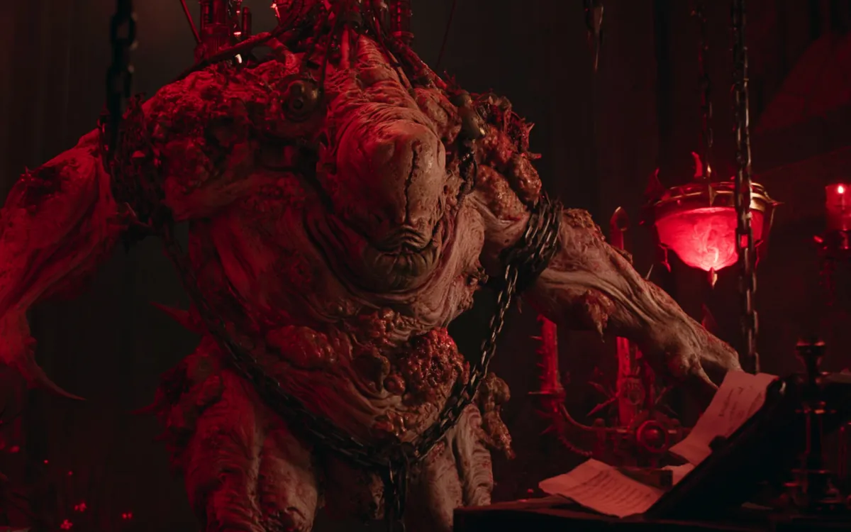 A chamber of the hold given over to the red, chains hung from the ceiling and a lamp burning over the work.