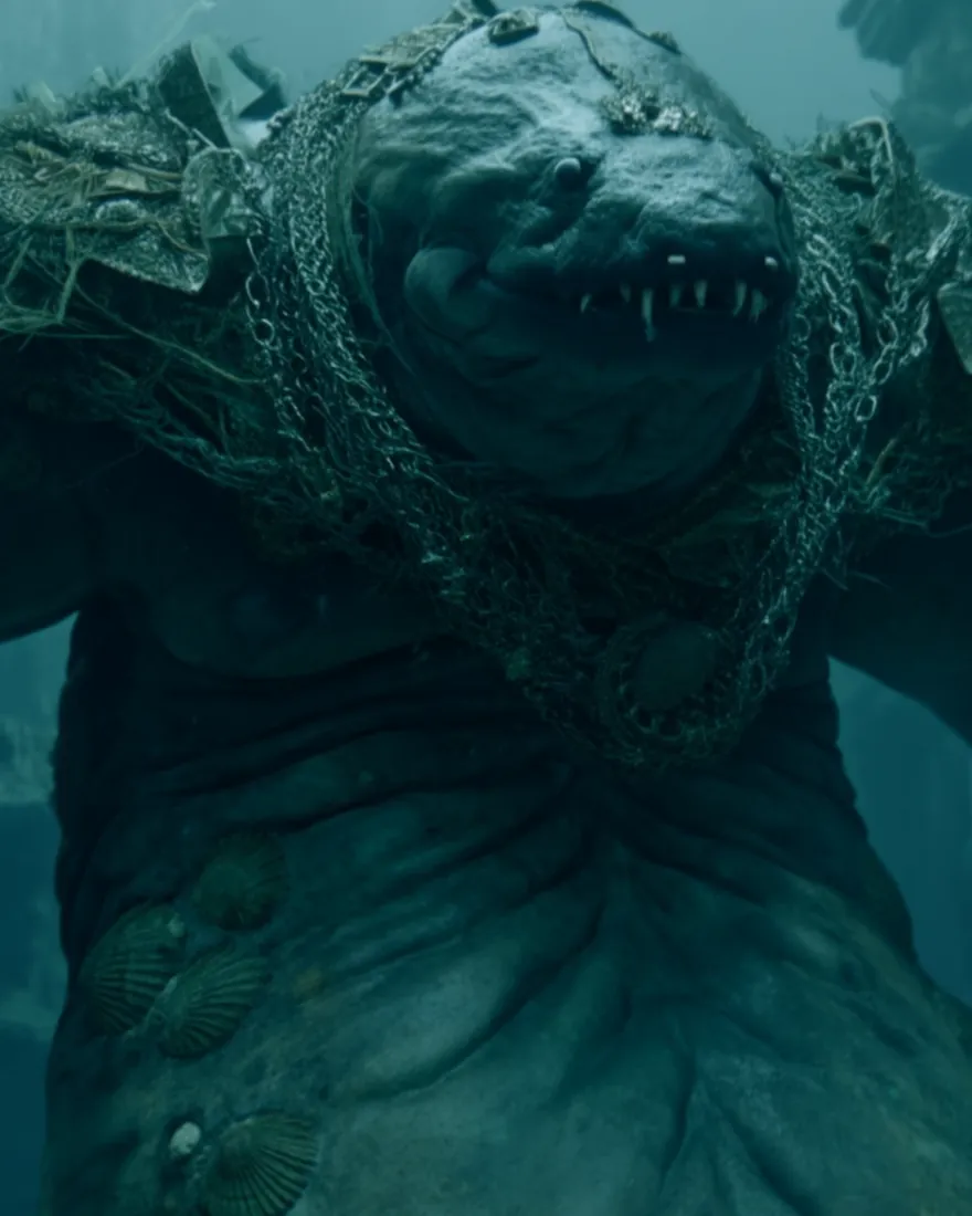 An Eeshmorg rising in the drowned streets, fifteen feet of it, the wide pointed head and its jagged teeth lit green by the water.