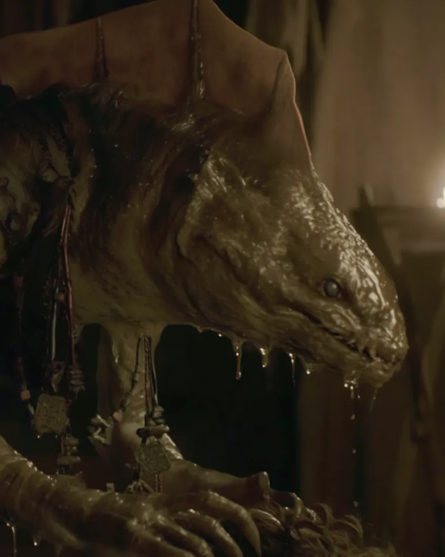A river Eesha bent over a bound man by lamplight, slime running off the hard lips and the jagged teeth.