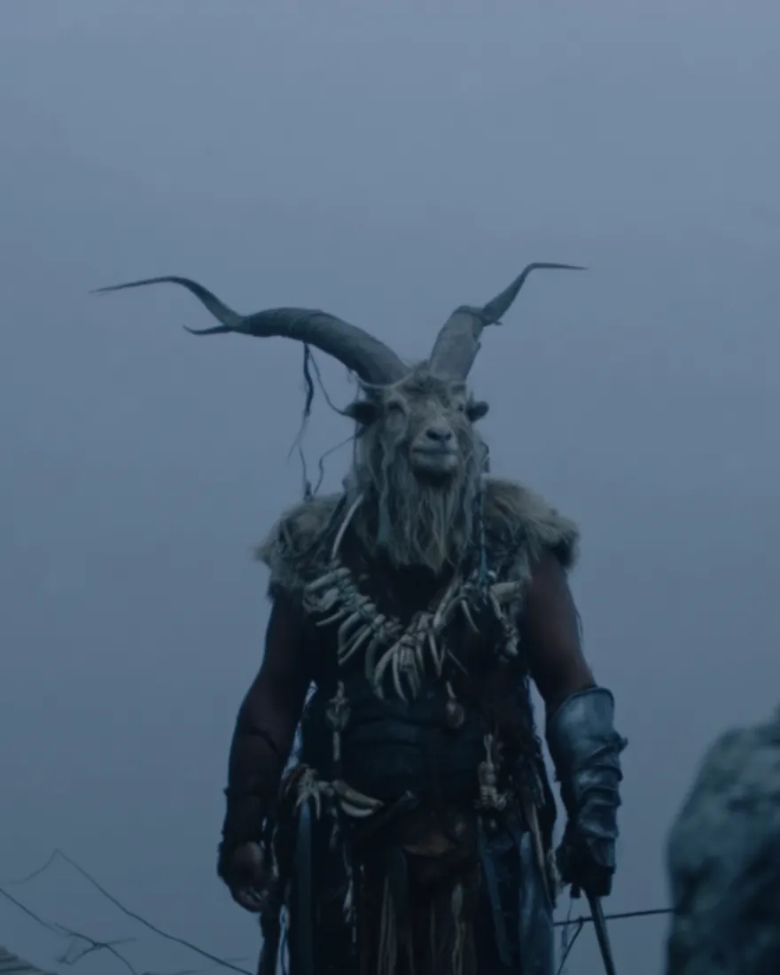 A Gidan holding a rope bridge in the high fog, the horns grown out well past the half circle a satyr stops at.